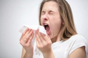 Young Woman Sneezing